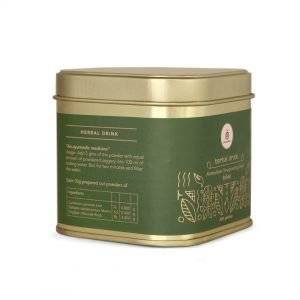 alt="Refreshing cup of Earthen Wellness Immunity Booster Drink prepared with Ayurvedic herbs"